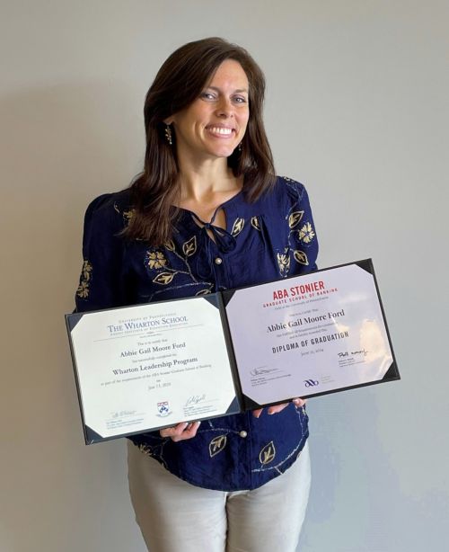 Abbie Ford graduate with diploma and certificate